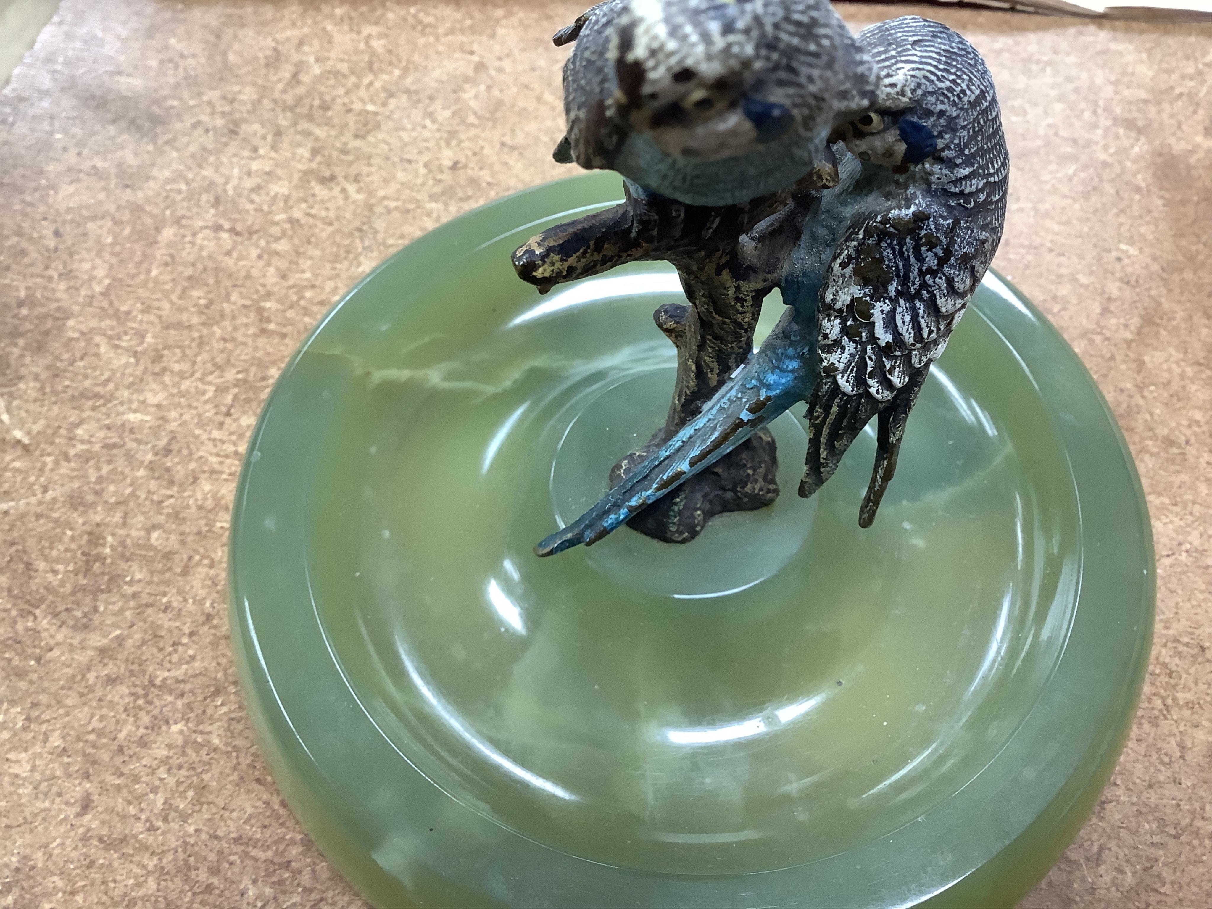 Two Art Deco bronze elephants and a cold painted bronze parakeet group, all on green onyx bases, tallest 17cm